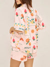 Rear view of the peach printed summer outfit, showing the back of the skirt and top for a full co-ord look from every angle.

