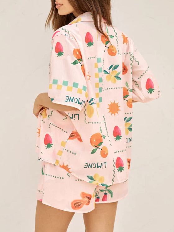 Rear view of the peach printed summer outfit, showing the back of the skirt and top for a full co-ord look from every angle.

