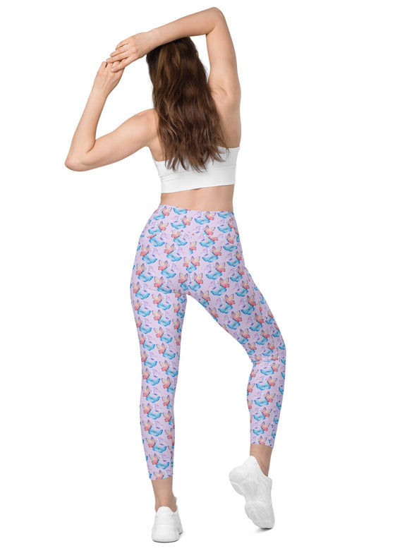 Model showing back view of lavender butterfly print high-waisted gym leggings, featuring a supportive and flattering fit with stylish butterfly details.