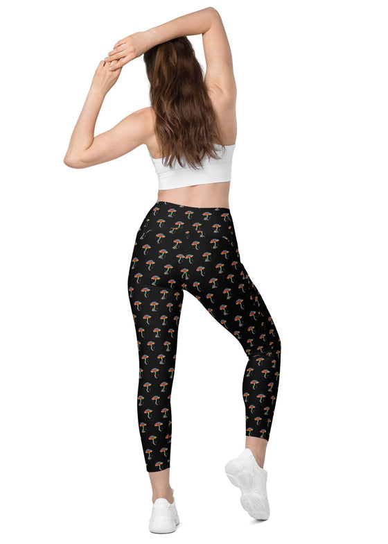 Model showing back view of Zen Frog black high-waisted leggings with pockets, featuring playful frog print, offering flexibility and comfort during exercises.