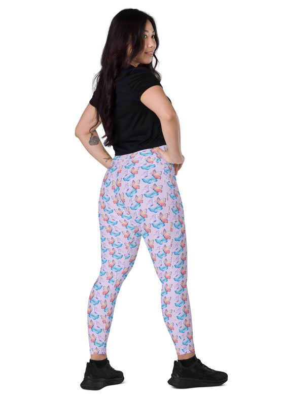 Back view of model wearing lavender butterfly print leggings with pockets, offering a flattering fit and practical design for women on the go.