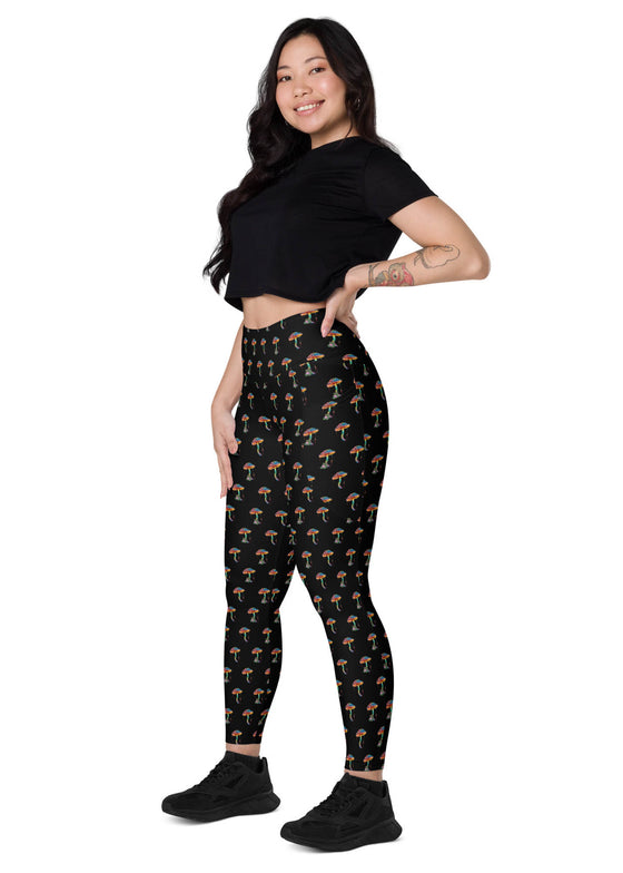 Model sitting sideways in Zen Frog high-waisted leggings with pockets, highlighting the playful frog print and offering maximum comfort and style.