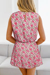 Back view of the model in the floral tank and mini skirt set, highlighting the tank top’s strap design and the skirt’s comfortable fit with the full floral print continuing beautifully.


