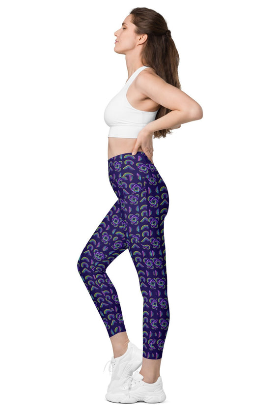 Model showing the side of Neon Rainbow Navy High Rise Leggings, featuring a supportive waistband and vibrant neon rainbow design, great for yoga or the gym.