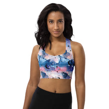  Model wearing Moonlight Aura watercolor high impact longline sports bra. Racerback style with soft compression fit in calming blue and purple tones.