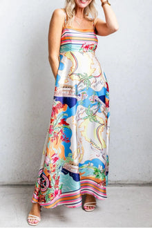 Model wearing the multicolor printed maxi dress in a full-length front view, highlighting the flowing hemline and elegant silhouette.

