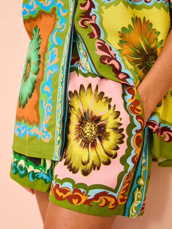 Close-up of the top section showcasing the lively multicolor pattern and neckline detail.