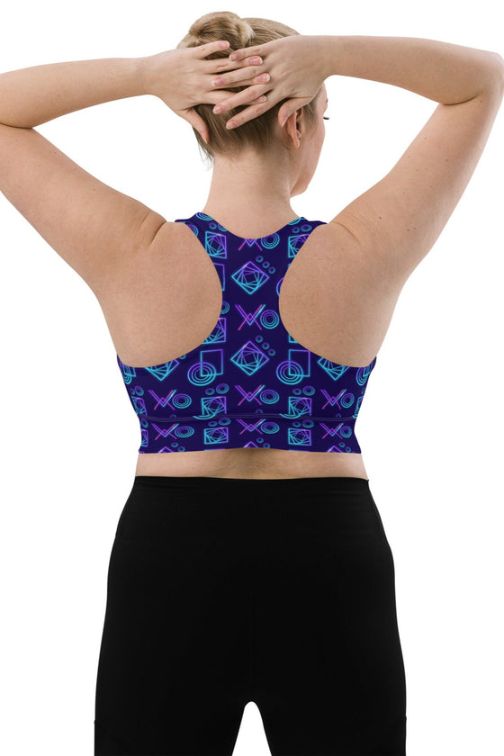 Back view of the Neon Geometry Navy High Impact Racerback Sports Bra in large size. Designed for ultimate support and mobility, featuring a bold neon geometric print and racerback for full range of motion.
