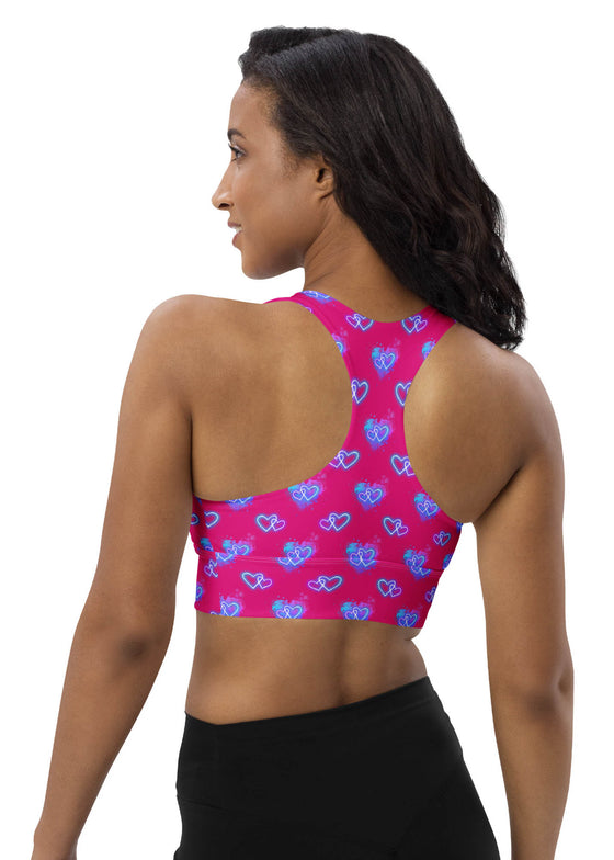 Back view of the Neon Heart Violet Red Racerback Sports Bra. Racerback cut offers full mobility, while high-impact support and breathable fabric ensure maximum comfort during workouts or everyday wear.
