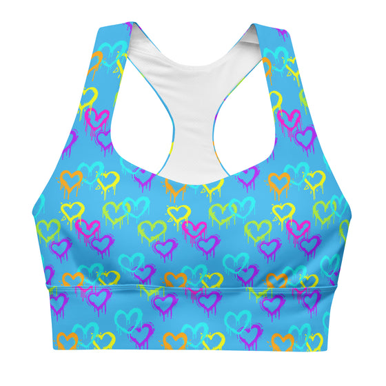 Front view of Neon Hearts Print Blue High Impact Sports Bra with neon hearts on a blue background. Offering high support, this sports bra is ideal for intense workouts and yoga, providing both comfort and style.