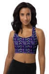 Woman wearing the Neon Rainbow Print Navy High Support Sports Bra. Bold neon rainbow patterns on a deep navy backdrop, providing high support for intense workouts, yoga, and casual wear.
