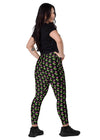 Model showcasing the convenient side pockets of neon roses black high-waisted leggings. Designed with a stylish floral print and high-waisted fit for a flattering and functional look.
