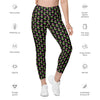 text details on neon roses black high-waisted leggings, featuring vibrant neon floral prints and side pockets for women's convenience. Perfect for fitness, yoga, or casual outings.
