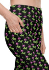 Close-up of neon roses black high-waisted leggings with pockets, showcasing the vibrant floral design and convenient side pockets for women’s essentials. Perfect for workouts or casual wear.