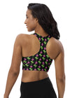 Back view of woman wearing Neon Roses Black Racerback Sports Bra. Double-layered front and shoulder straps offer high support, perfect for high-impact workouts, while the racerback design enhances mobility.