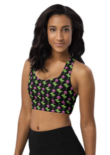  Woman wearing Neon Roses Black Racerback Sports Bra, featuring a vibrant neon rose print on black fabric. Designed for high-impact activities, this sports bra provides maximum support and comfort for workouts.