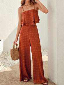  Model wearing an orange-red layered cami top paired with wide-leg pants, styled in a relaxed summer-ready front outfit.