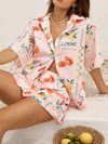  Front view of a peach printed summer outfit with a breezy button-down top and relaxed-fit skirt designed for warm-weather comfort and casual elegance.