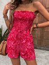 Front view of the Perfee Smocked Printed Tube Romper with a floral print and smocked bodice.