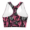 Closeup of racerback and stitching detail on high impact sports bra with pink and black cactus design. Breathable mesh lining and longline silhouette included.