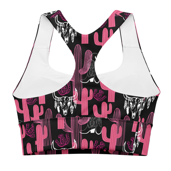 Closeup of racerback and stitching detail on high impact sports bra with pink and black cactus design. Breathable mesh lining and longline silhouette included.