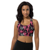 Model wearing pink and black cactus print high impact longline sports bra with racerback. Designed for gym workouts, featuring strong support and bold style.