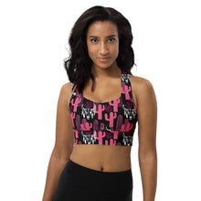  Model wearing pink and black cactus print high impact longline sports bra with racerback. Designed for gym workouts, featuring strong support and bold style.