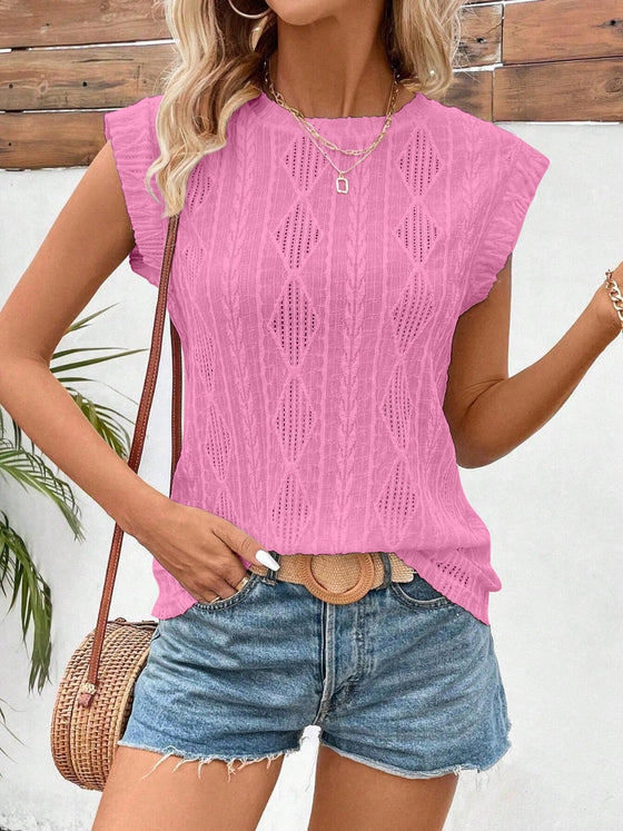 Scalloped embroidery stands out in this frontal shot, blending playful charm and refined design.

