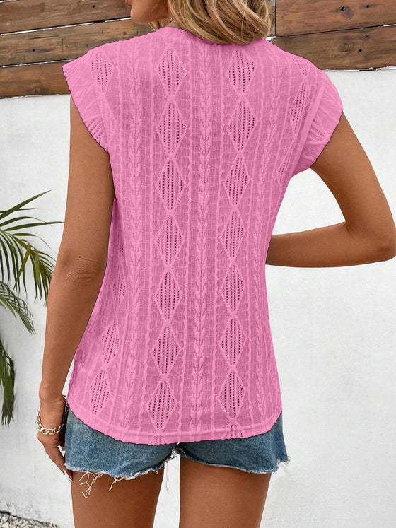 Back image showing the structure of the waist and delicate eyelet cut-outs across the fabric.

