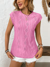 Model wears pink version of the top, emphasizing the round neck cut and elegant eyelet embroidery.


