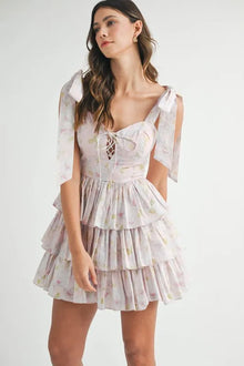  Front view of the Pink Floral Print Layered Mini Dress, showcasing the playful layered design and vibrant floral print.