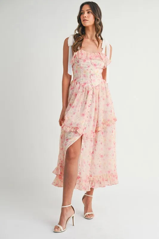 Pink Floral Midi Dress with shoulder straps shown in daylight with a fresh and flowing design