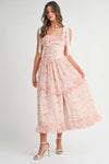 Front view of Pink Floral Midi Dress with shoulder straps and soft floral pattern in gentle lighting

