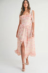 Pink Floral Shoulder Strap Midi Dress in a front-facing outdoor shot capturing summer warmth