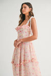 Breezy side angle of Pink Floral Midi Dress with shoulder straps and graceful lines