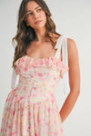 Relaxed shot of Pink Floral Midi Dress highlighting its airy shape and soft florals