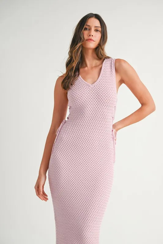 Delicate lavender style from the front of the Pink Lavender Lace Up Knit Midi Dress featuring a classic lace-up look.