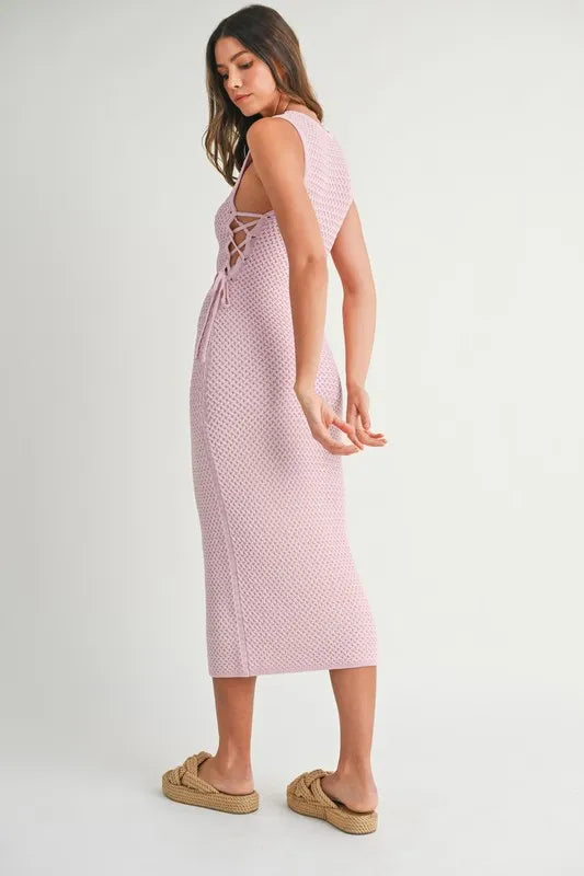  Graceful curve style of the Pink Lavender Lace Up Knit Midi Dress seen from the side, enhancing the fit.