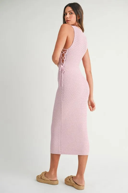 Soft profile look of the Pink Lavender Lace Up Knit Midi Dress showing elegant side lace-up design.