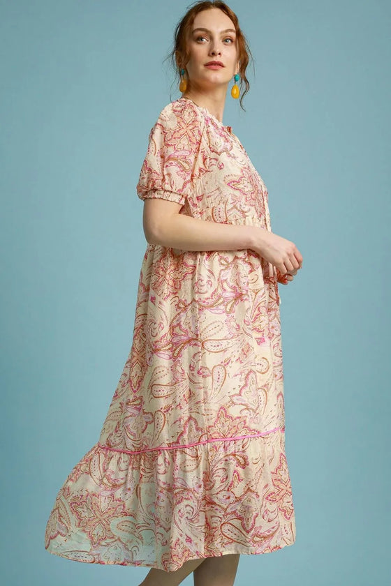Side view of the Pink Mix Printed Puff Short Sleeve Midi Dress, showcasing the dress’s flowy silhouette and the elegant puff short sleeves.