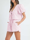 Another front view of the pink set, focusing on the vibrant color, the voluminous puff sleeves, and the flattering high-waisted shorts, making it perfect for a sunny day.


