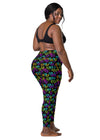 Plus-size model showcasing the back of Black Rainbow Melting Hearts High-Waisted Compression Leggings, designed for flexibility, support, and a secure fit during workouts.