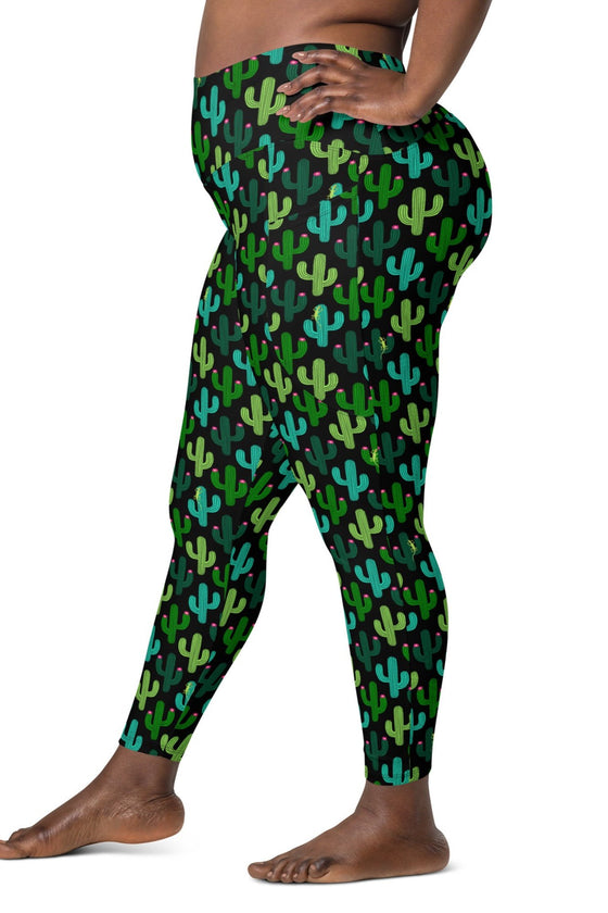 Side view of a plus-size woman wearing Cactus Bloom Black High-Waisted Leggings with pockets, designed for yoga, fitness, and all-day comfort.