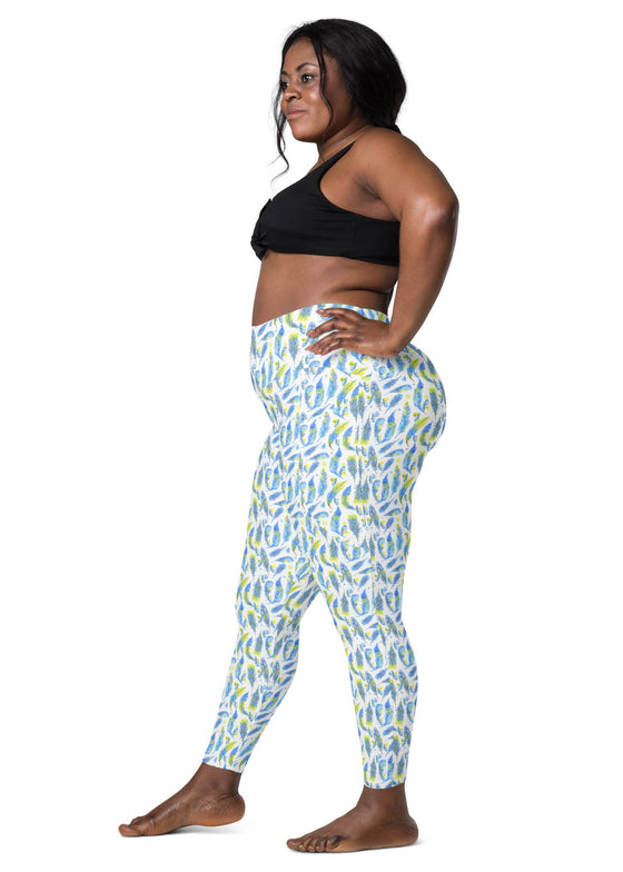 Side view of a plus-size woman wearing Teal Feather Print High-Waisted Yoga Leggings with pockets, offering compression, support, and stretch for gym and casual wear.