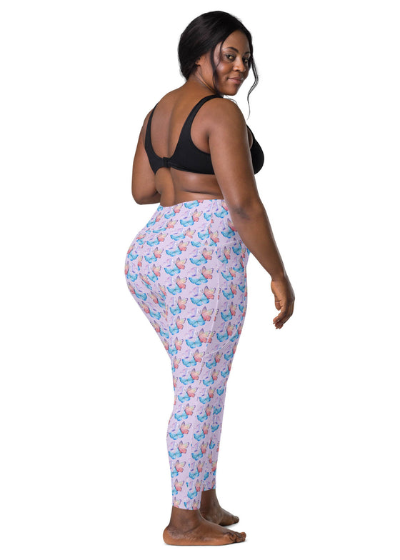 Plus-size woman in back view of lavender butterfly print high-waisted leggings, designed for both style and performance.