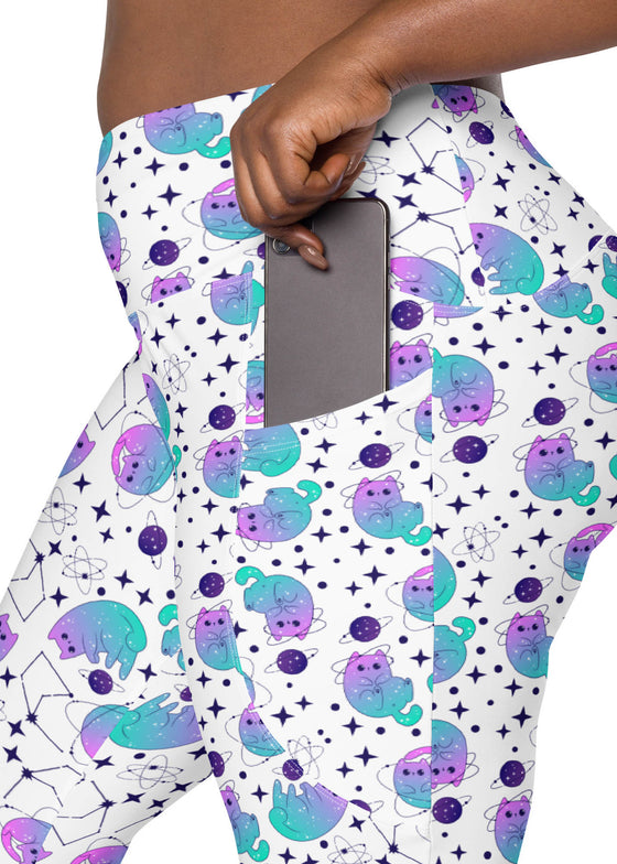 Closeup of plus-size woman showing pocket design on Cosmic Cats White High-Waisted Leggings. Pockets add functionality to these cute cat-themed gym leggings.