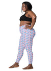 Plus-size woman in side view of lavender butterfly print high-waisted leggings, designed for both style and performance.