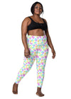 Plus-size woman wearing Melting Hearts White Compression Leggings. These high-waisted leggings with pockets offer a flattering fit for all body types, ideal for yoga and fitness.