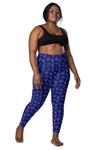 Plus-size woman wearing Neon Geometry Navy High Rise Gym Leggings. Flattering high-rise fit with geometric print and functional pockets, ideal for plus-size women's workout leggings.