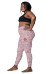 Plus-size woman wearing Pastel Pink Girl Power Print Yoga Leggings, side view, emphasizing the comfortable high-waisted fit and empowering design. Perfect for every woman’s activewear collection.